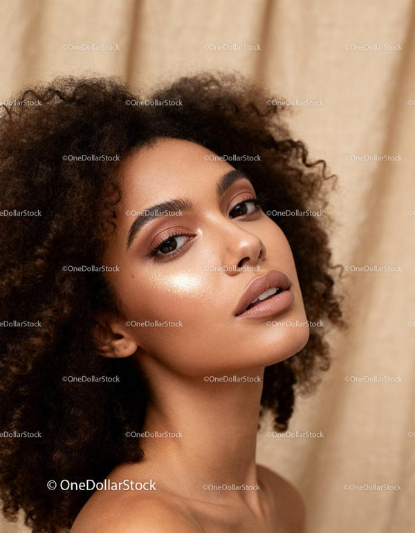 Elegant woman with glowing skin and natural makeup