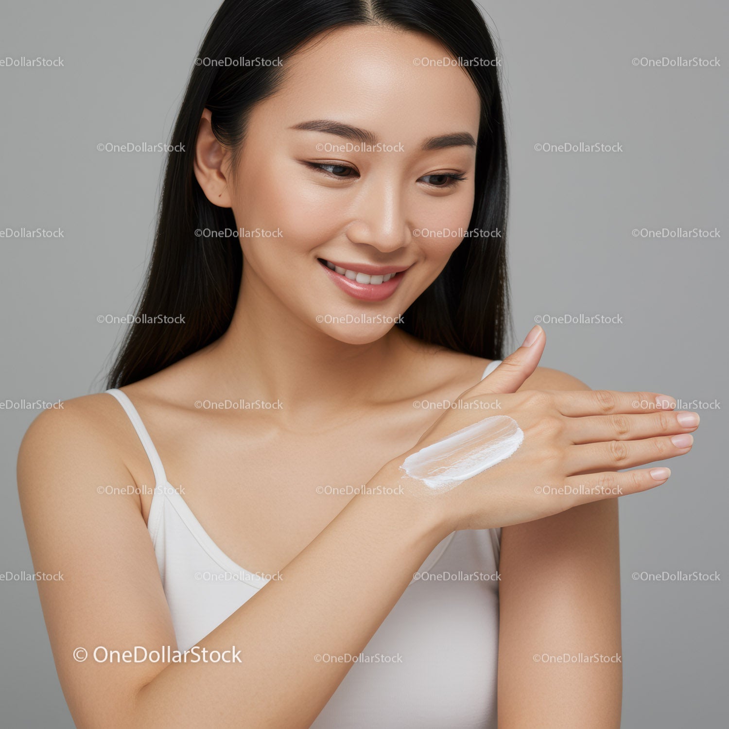Young Woman Applying Lotion on Hand for Skincare Routine