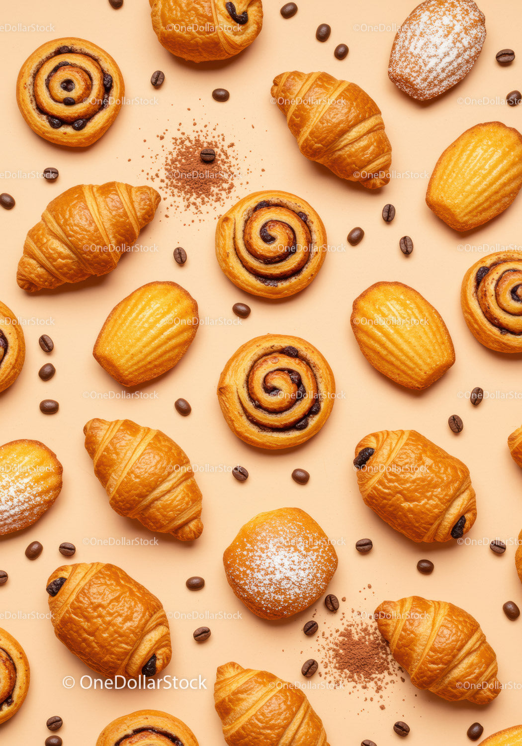 Fresh assorted pastries with coffee beans on beige background
