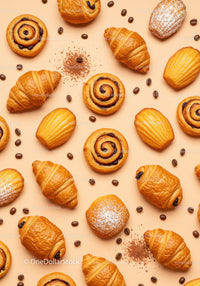 Fresh assorted pastries with coffee beans on beige background