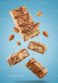 Chocolate Almond Protein Bars Floating on Blue Background