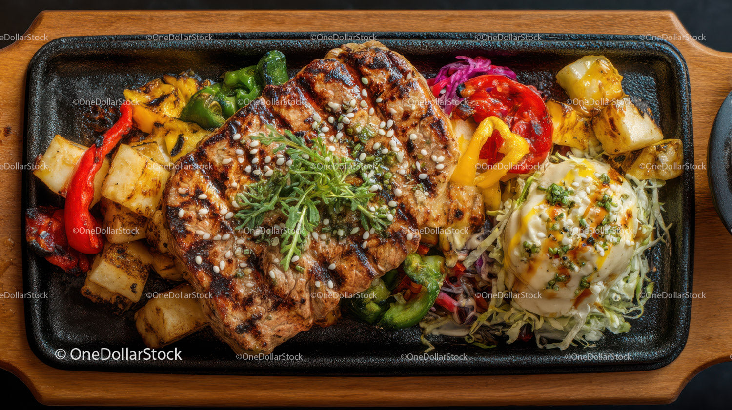 Grilled Pork Chop with Roasted Vegetables and Pineapple on Sizzling Plate