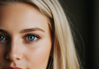 Close up of blue-eyed woman with natural makeup