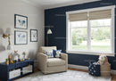 Kids Room with Beige Armchair and Toy Storage near Window