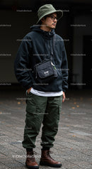 Casual Young Man in Hoodie Cargo Pants Leather Boots Outdoor
