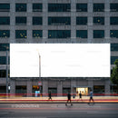 Urban Pedestrians Passing by Large Blank Billboard at Dusk
