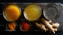 Assorted Spices and Fresh Ginger Root on Rustic Wooden Surface
