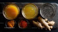 Assorted Spices and Fresh Ginger Root on Rustic Wooden Surface