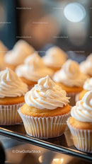 Fresh Vanilla Frosted Cupcakes with Swirled Icing on Display