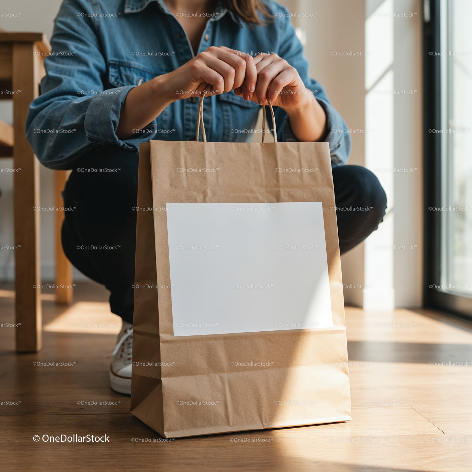 Woman holding brown paper shopping bag indoors
