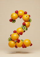 Number two composed of fresh tropical fruits on beige