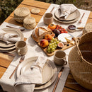 Cozy outdoor table set with fresh fruit and cheese