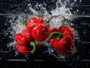 Red Bell Peppers Splash Underwater in Bright Food Photography