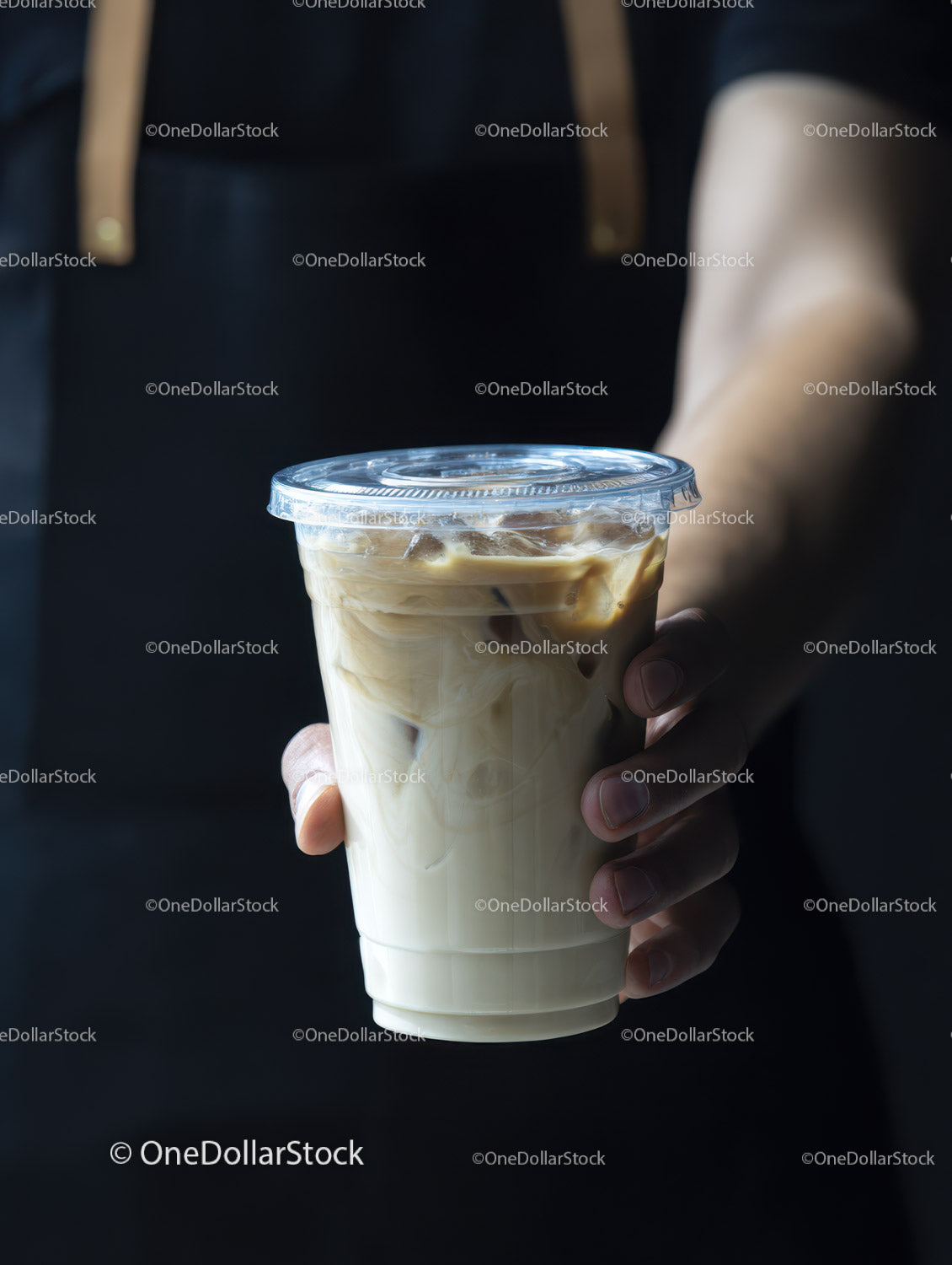 Iced Latte in a Clear Glass Cup with Milk Swirl and Dark Background