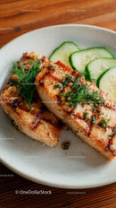 Fresh Grilled Salmon with Cucumber Garnish in White Bowl