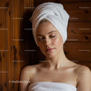 Relaxing Woman with Towel Wrap in Spa Setting