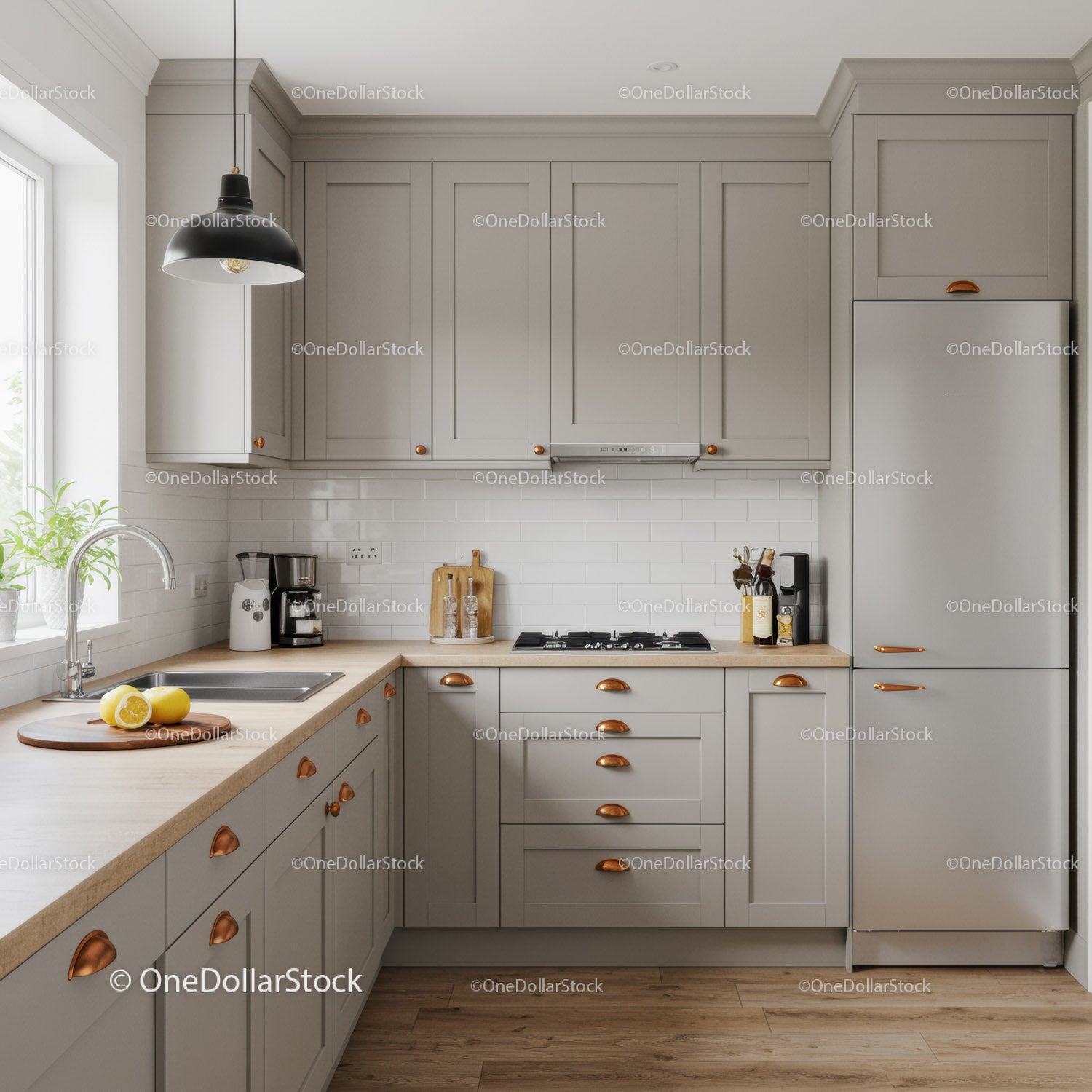 Modern Kitchen with Gray Cabinets and Copper Handles in Bright Home Environment