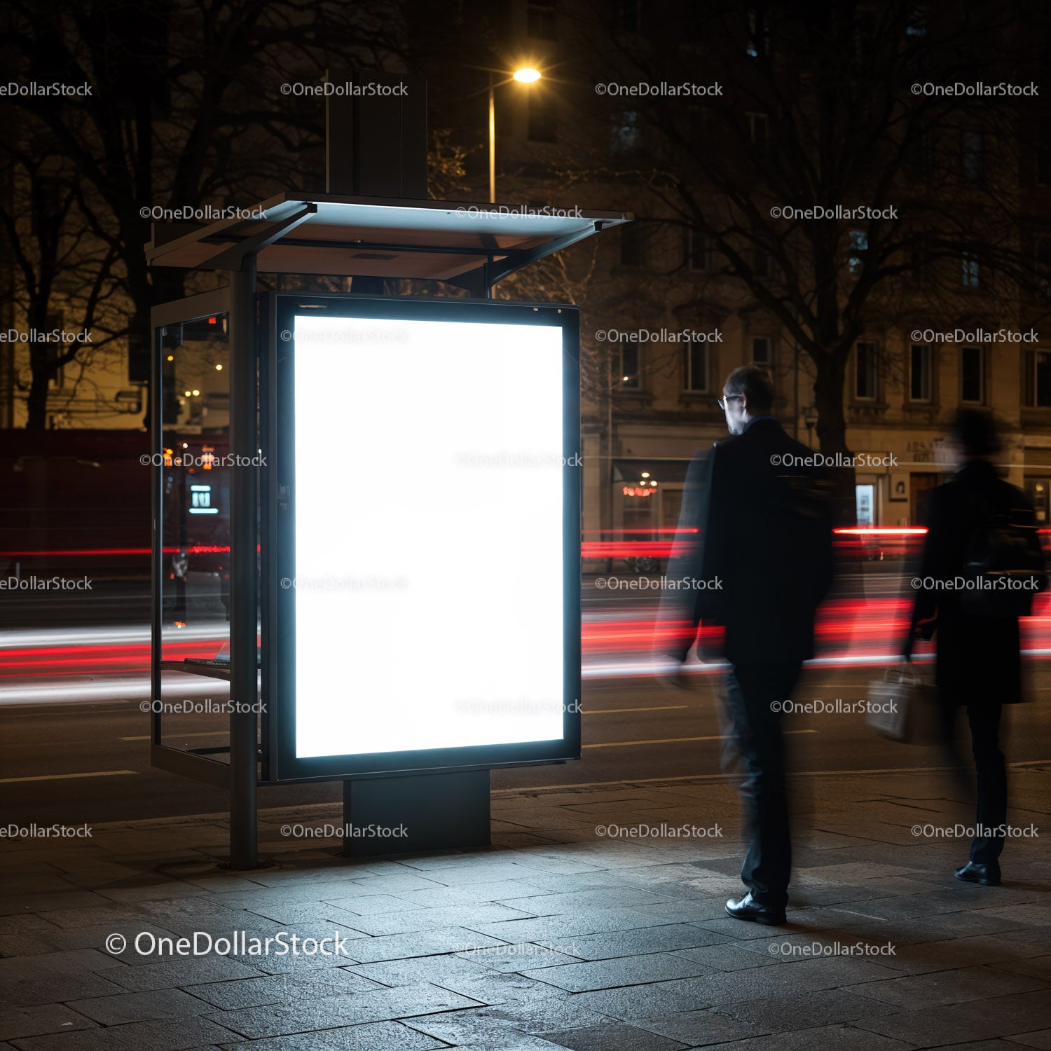 Illuminated Bus Stop Advertisement in Urban Night Scene