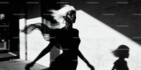 Elegant woman with flowing hair in dynamic silhouette