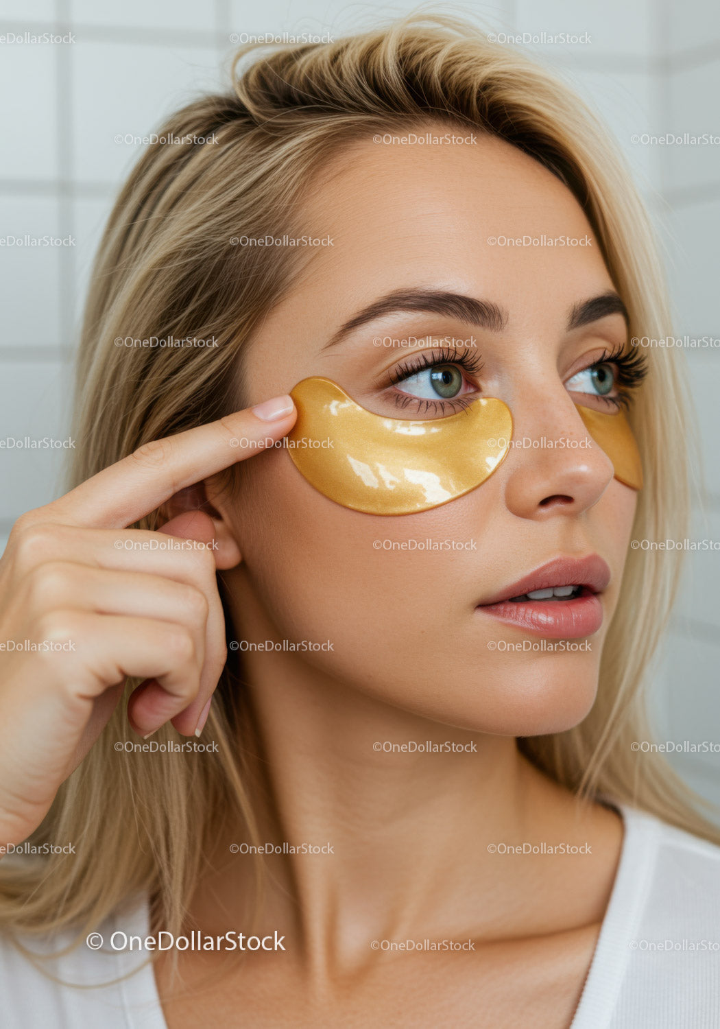 Woman Relaxing with Gold Under Eye Patches for Rejuvenation