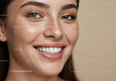 Close up of smiling young woman with freckles