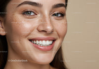 Close up of smiling young woman with freckles
