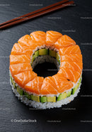Fresh salmon and avocado sushi ring on slate plate