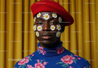 Fashion portrait of man with daisies on face and red beret