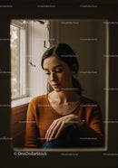 Contemplative Woman Looking Out Window in Cozy Indoor Setting