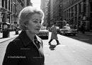 Elegant Elderly Woman Walking Through Busy Urban City Street