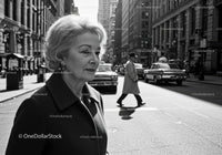 Elegant Elderly Woman Walking Through Busy Urban City Street
