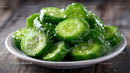 Fresh Green Cucumber Slices on a White Plate