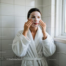 Woman Applying Facial Mask for Skincare and Relaxation