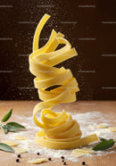 Fresh fettuccine pasta spiraling with flour dust