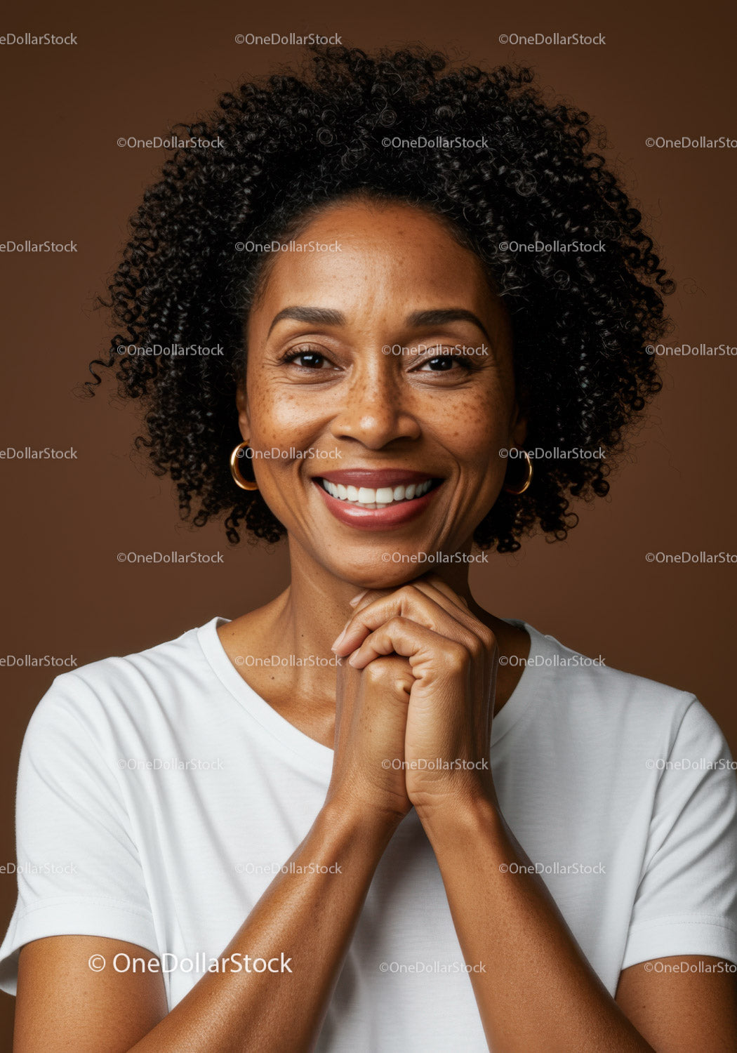 Joyful Woman with Curly Hair and Bright Smile in Studio Portrait