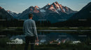 Adventurous Man Enjoying Scenic Mountain Reflection at Sunset