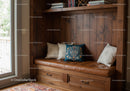 Cozy Window Nook with Leather Bench and Cushions in Warm Wooden Interior