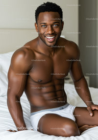 Smiling muscular man sitting relaxed in white underwear