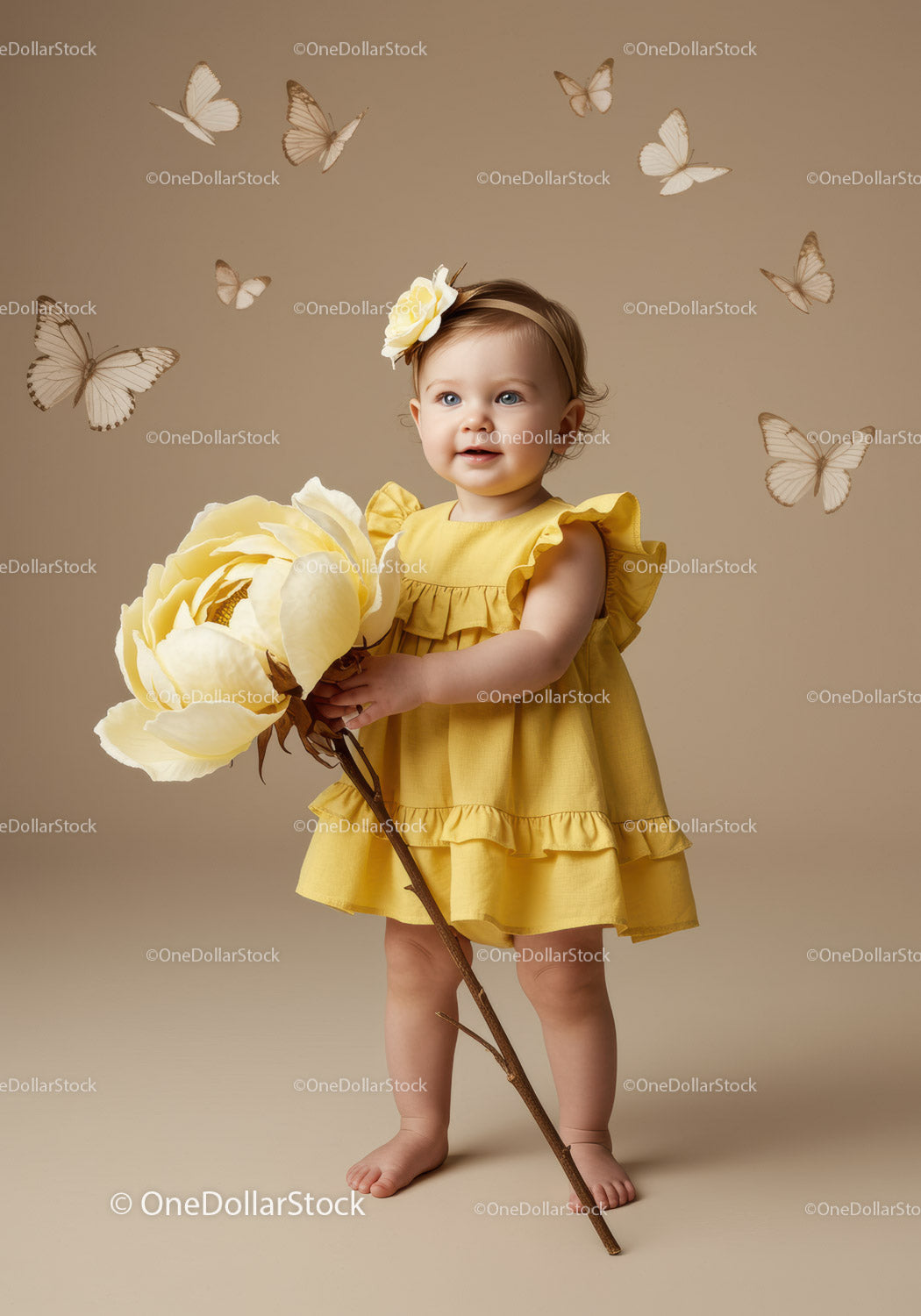 Toddler girl in yellow dress holding giant flower