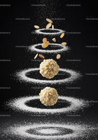Almond covered truffles surrounded by powdered sugar rings
