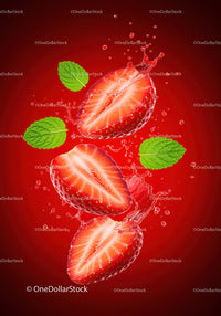 Fresh strawberry halves with mint leaves and water splash