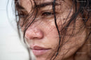 Close-up of Woman with Wet Hair and Expressive Eyes