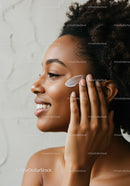 Beautiful Woman Applying Face Cream with Skincare Routine