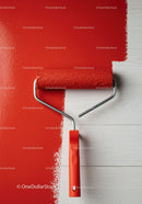 Red Paint Being Applied with Roller on White Wall for Home Renovation
