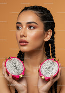 Elegant Woman with Braided Hair Holding Fresh Dragon Fruit Halves