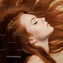 Profile view of serene woman with flowing red hair
