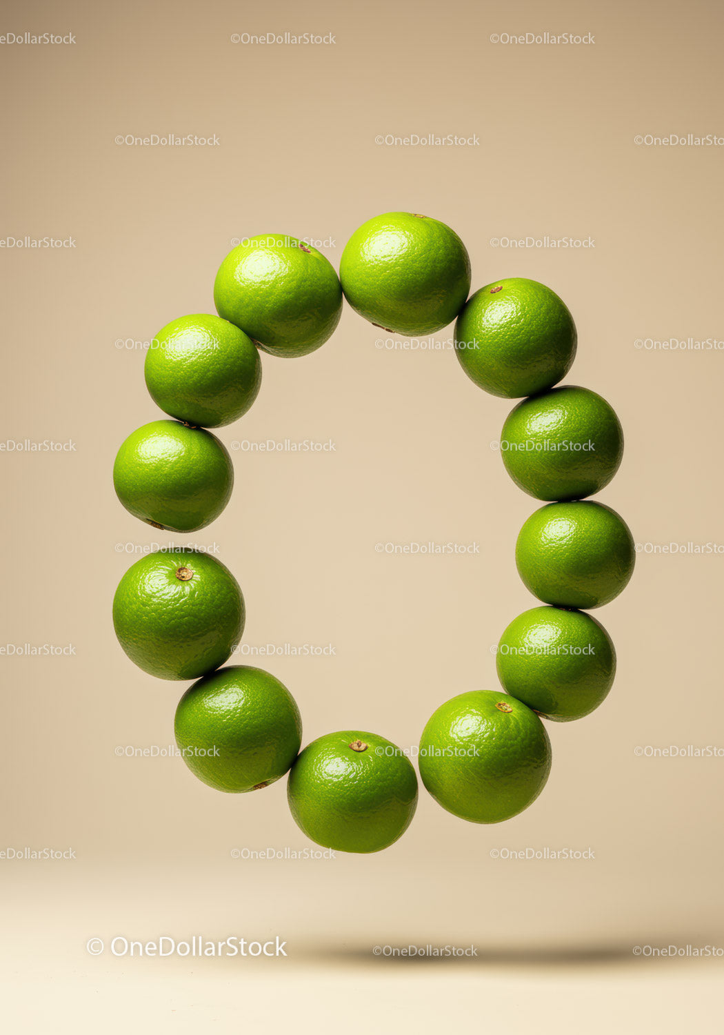 Circle of Fresh Limes on Soft Beige Background