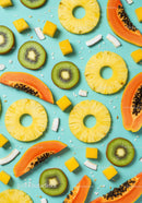 Tropical fruits spread on vibrant turquoise background