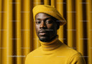 Stylish man in mustard beret and turtleneck sweater