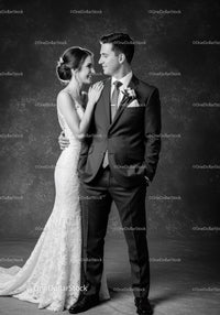 Bride and groom sharing intimate moment in studio